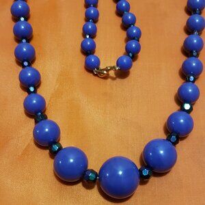 Purple Necklace With Multi Color Fauceted Black Beads.